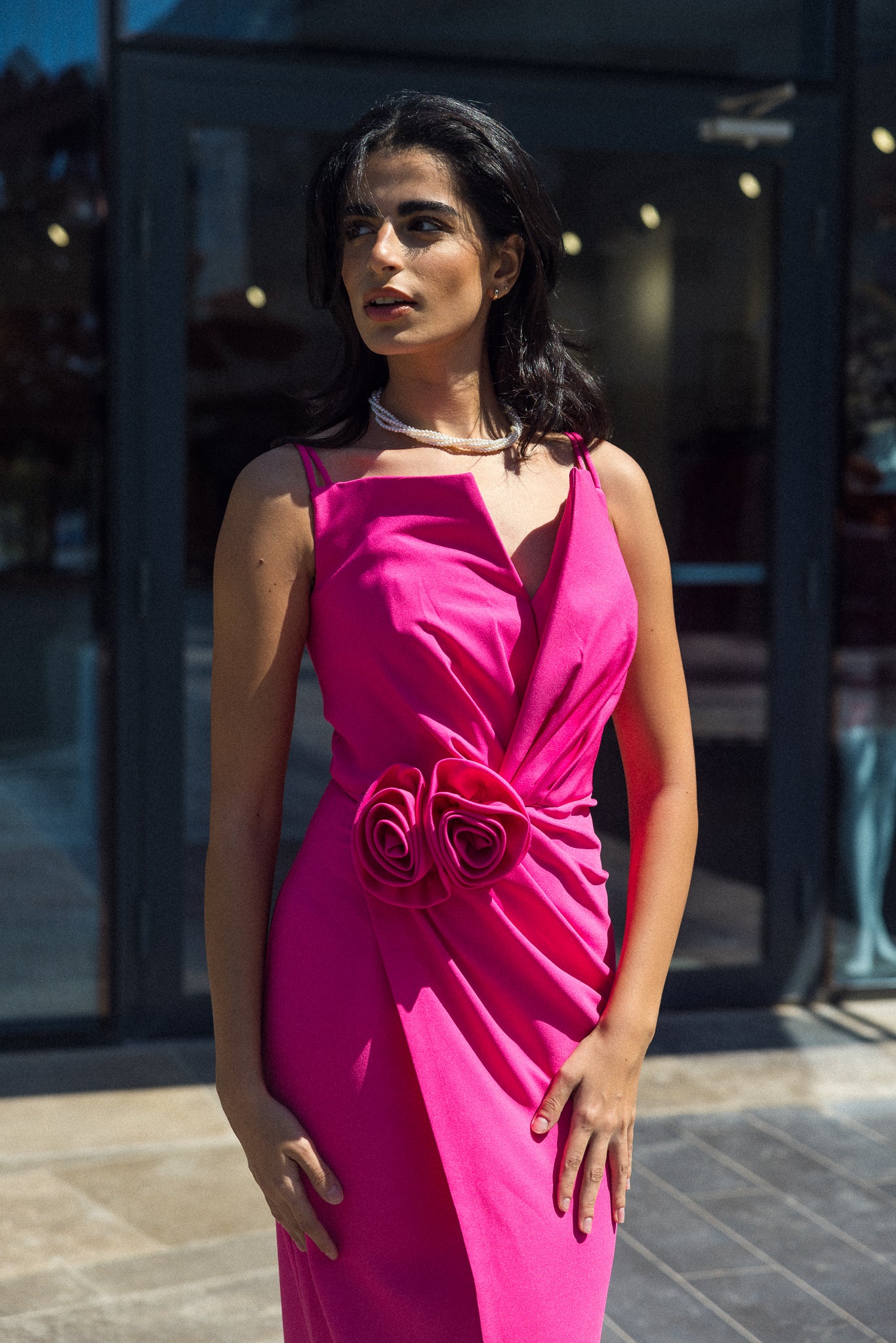 Sleeveless long dress with flower in Fuchsia