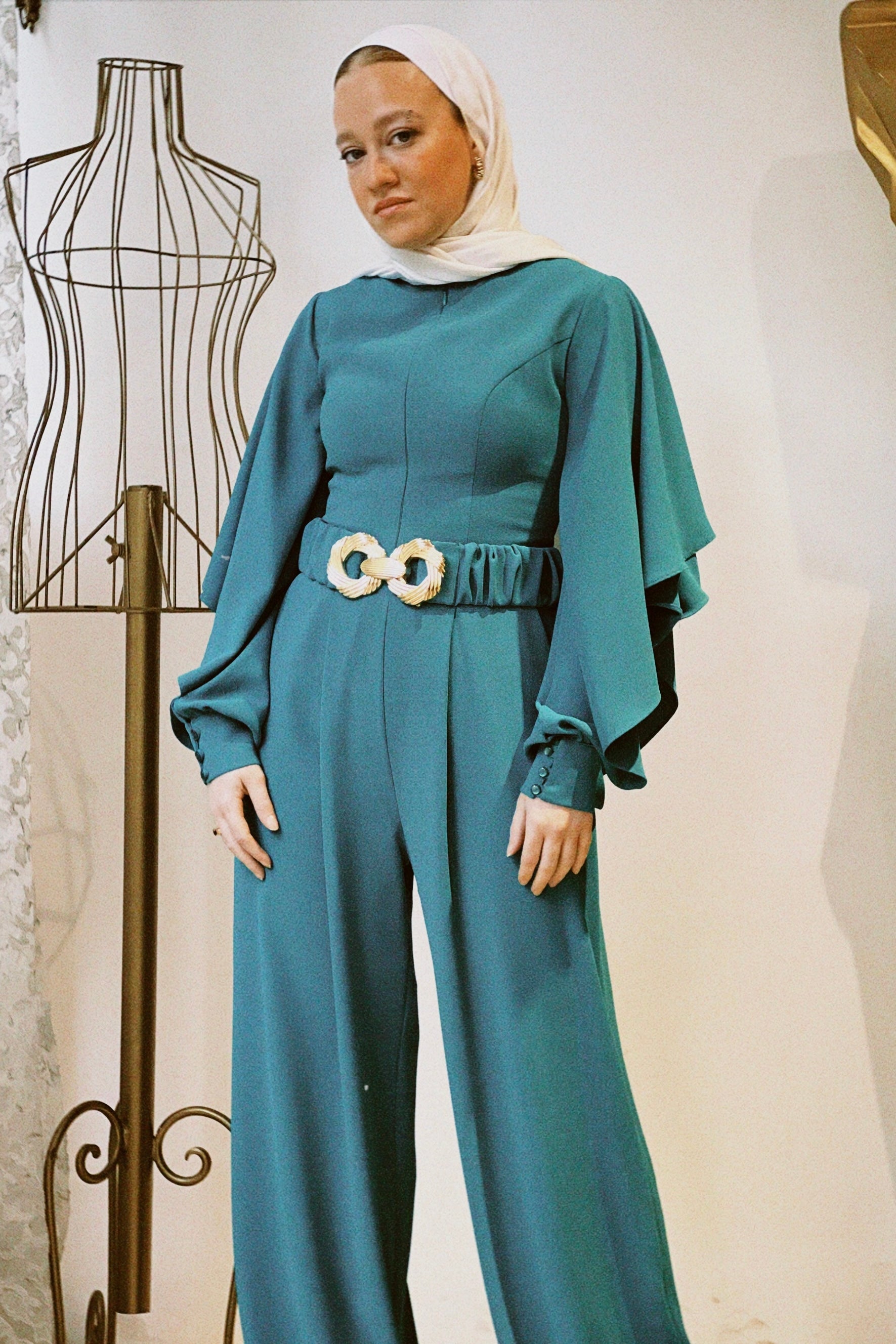 Long sleeve ruffled jumpsuit in Teel
