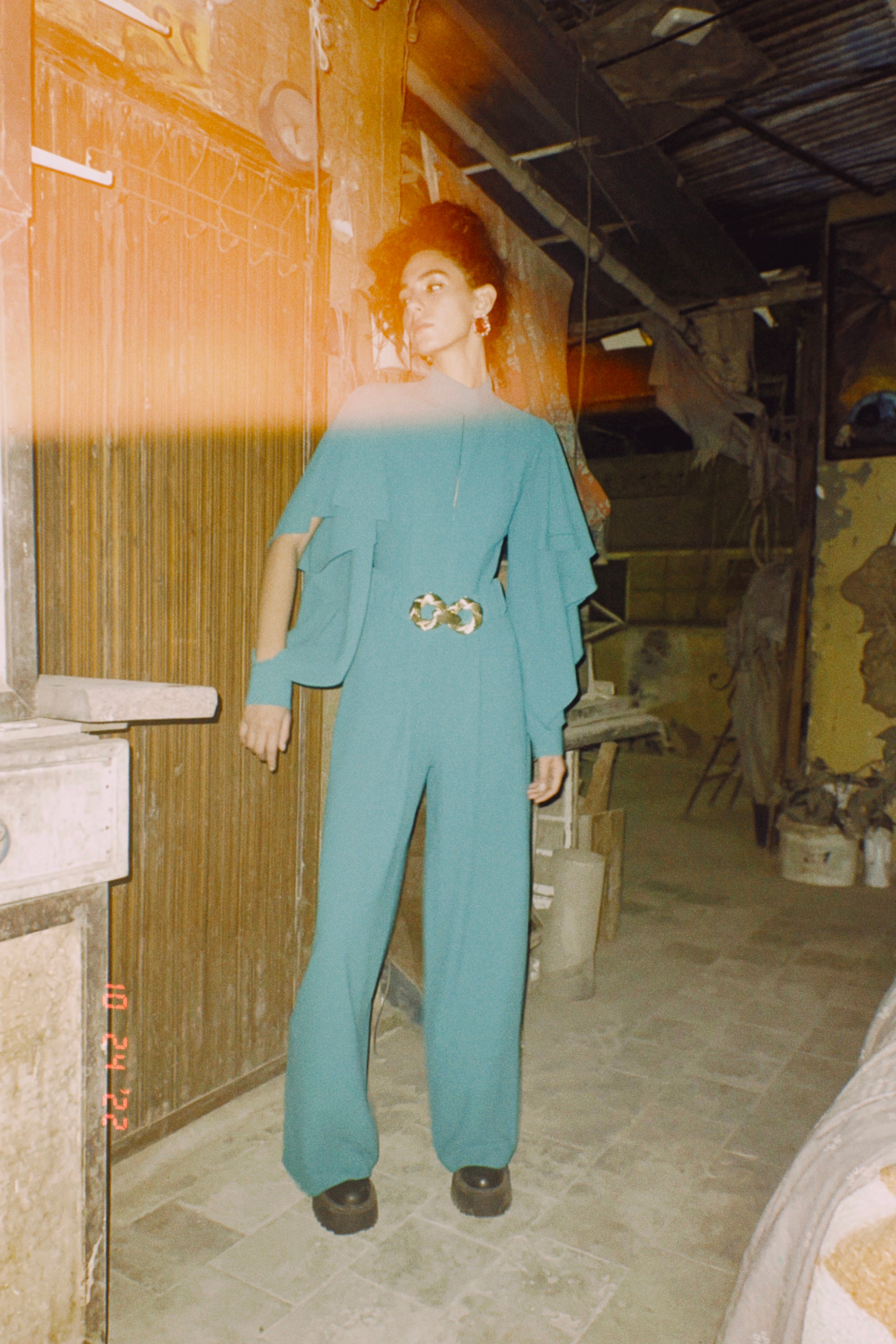 Long sleeve ruffled jumpsuit in Teel