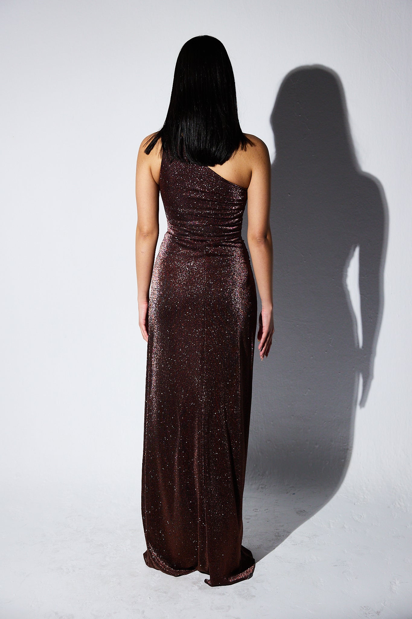 Shimmery One shoulder dress with slit in Brown