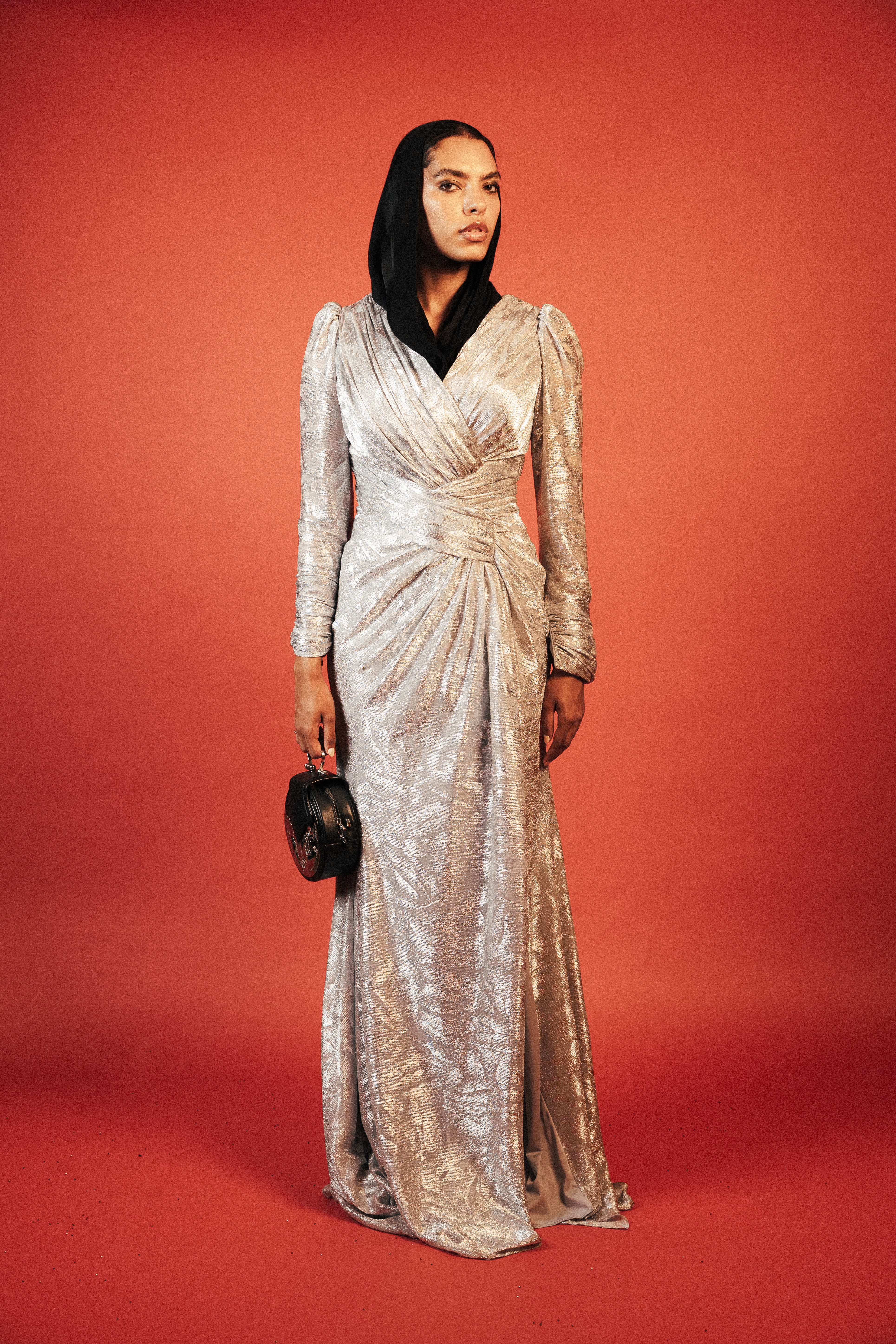 Long sleeve shimmery dress with slit in sliver