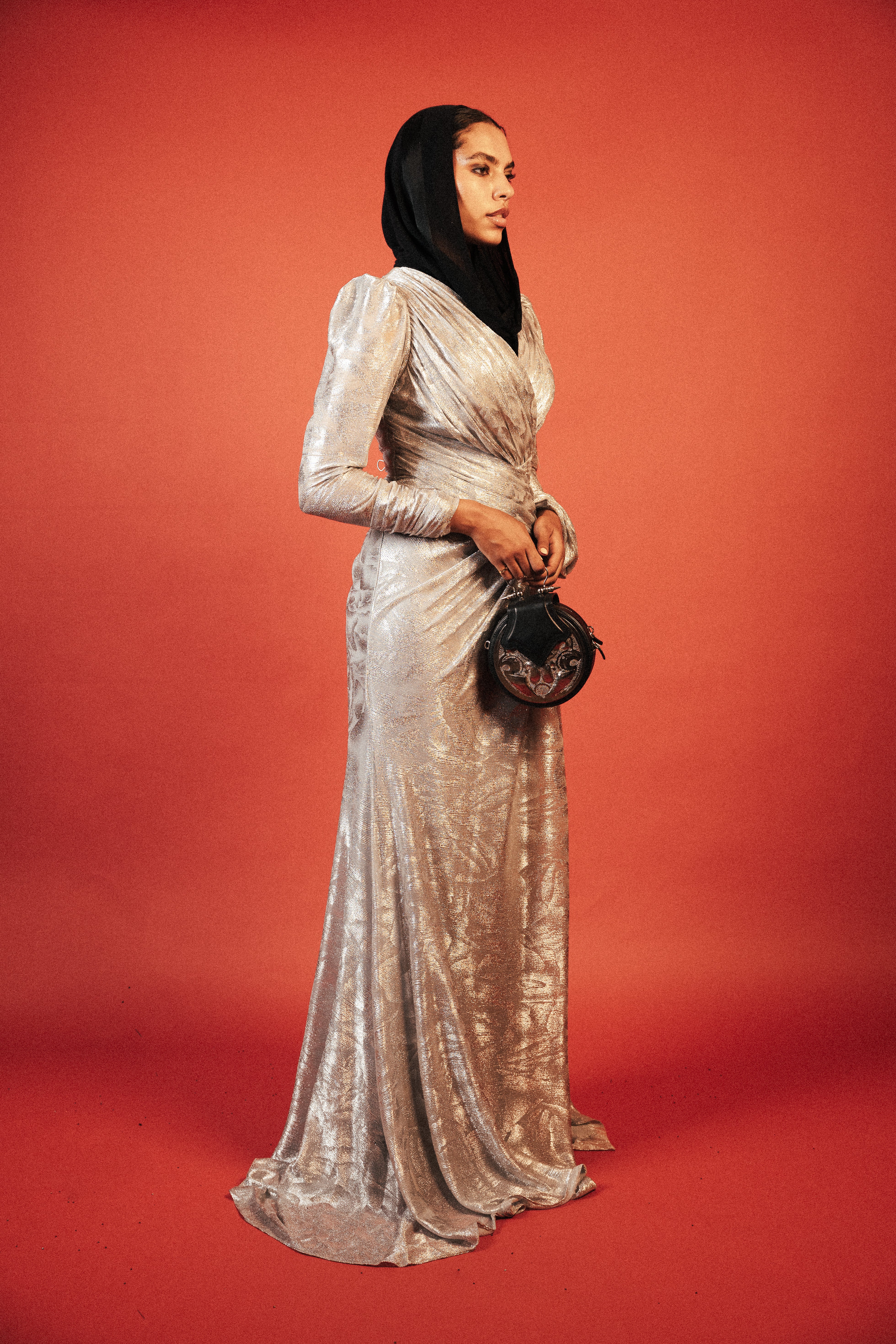 Long sleeve shimmery dress with slit in sliver