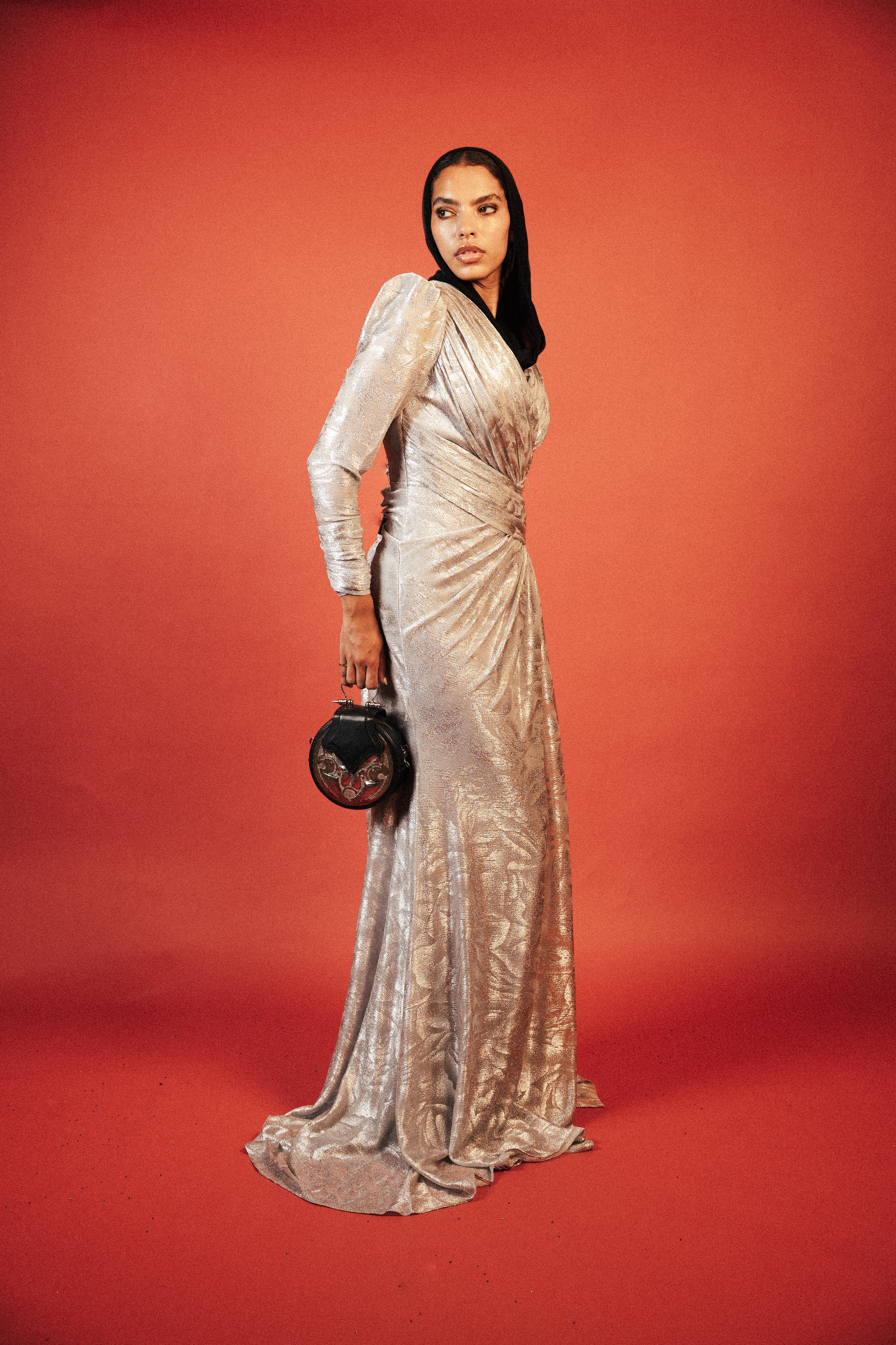 Long sleeve shimmery dress with slit in sliver